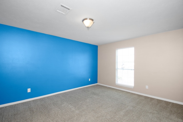 spare room featuring carpet flooring