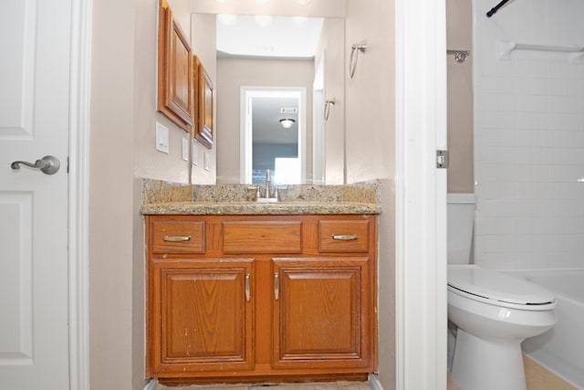 full bathroom featuring vanity, toilet, and washtub / shower combination