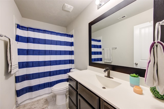 bathroom featuring a textured ceiling, toilet, vanity, tile patterned floors, and a shower with shower curtain