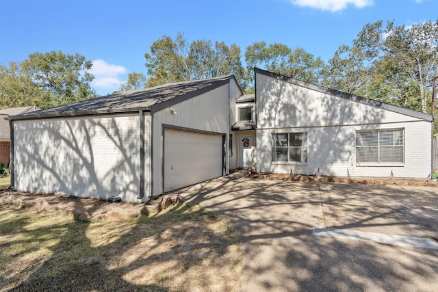 single story home featuring a garage