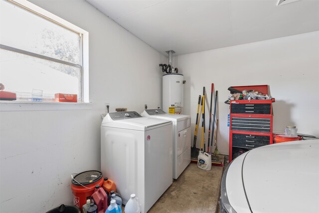 washroom featuring gas water heater and washer and clothes dryer