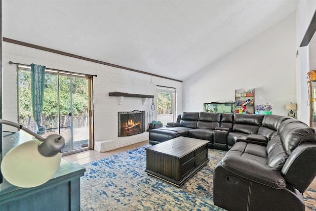 tiled living room featuring brick wall, vaulted ceiling, and a fireplace