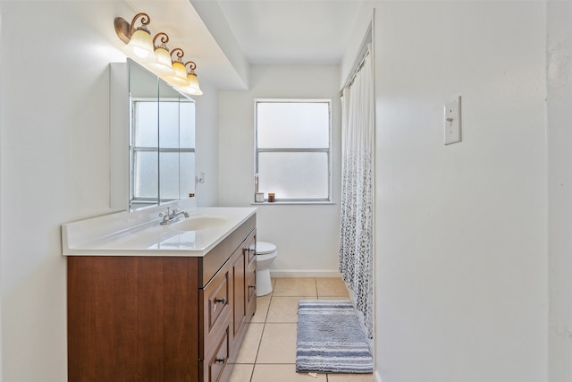 bathroom featuring vanity, toilet, and tile patterned floors