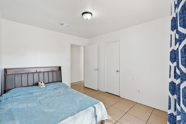 1603 Cantrell Blvd, Conroe, TX 77301 - tiled bedroom featuring baseboards