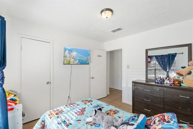 1603 Cantrell Blvd, Conroe, TX 77301 - bedroom featuring light tile patterned floors
