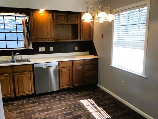 kitchen featuring stainless steel dishwasher, sink, dark hardwood / wood-style floors, and plenty of natural light