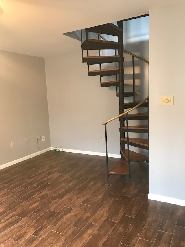 stairs featuring hardwood / wood-style floors