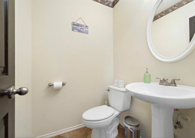 bathroom featuring tile patterned floors, sink, and toilet