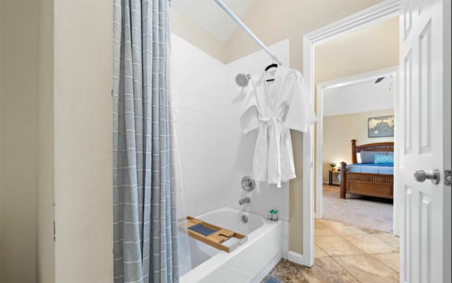 bathroom with tile patterned floors and shower / tub combo