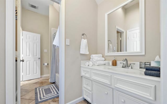 bathroom featuring vanity and tile patterned flooring