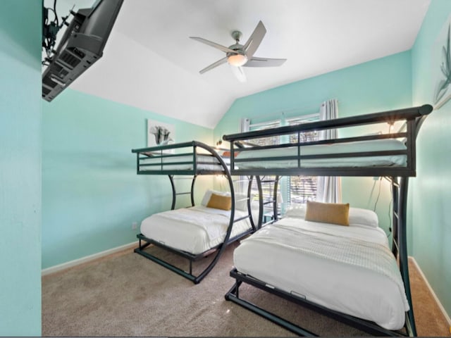 bedroom featuring lofted ceiling, carpet flooring, and ceiling fan