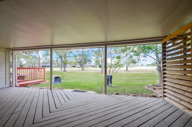 wooden deck with a lawn