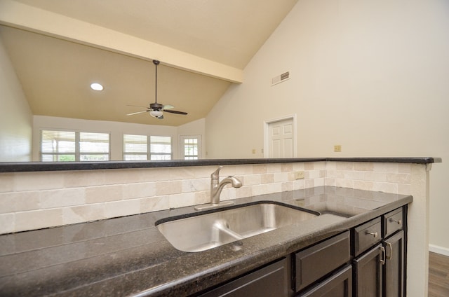 kitchen with lofted ceiling, dark hardwood / wood-style floors, sink, and ceiling fan