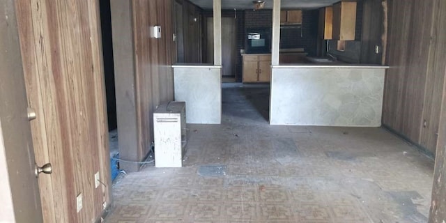 kitchen featuring wooden walls