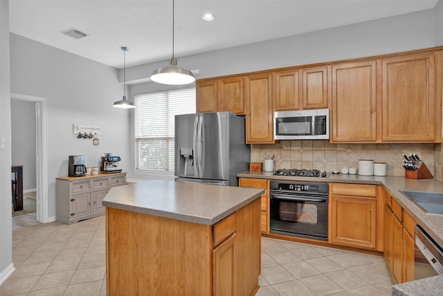 kitchen with tasteful backsplash, light tile patterned floors, stainless steel appliances, decorative light fixtures, and a center island