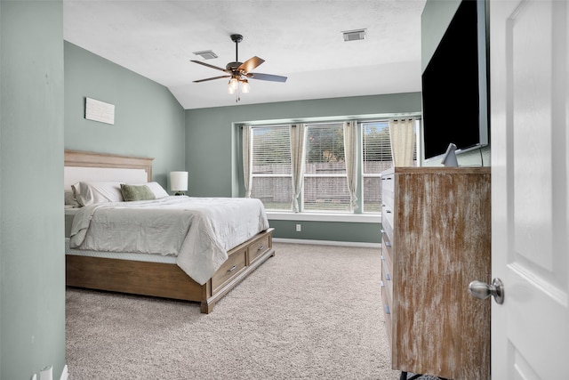 carpeted bedroom featuring ceiling fan and lofted ceiling