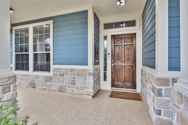 doorway to property with covered porch