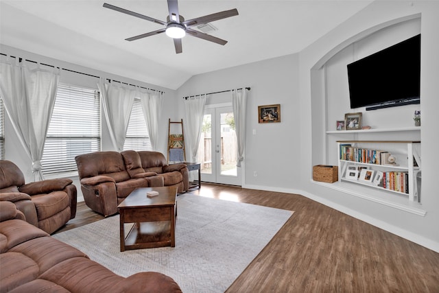 living room with lofted ceiling, hardwood / wood-style floors, french doors, and ceiling fan