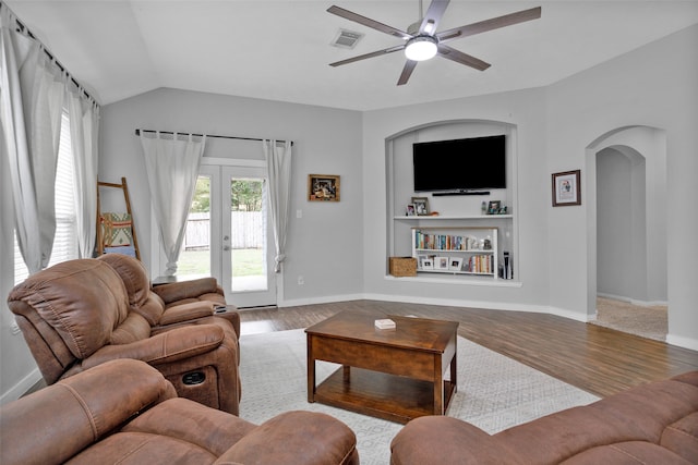 living room featuring french doors, hardwood / wood-style floors, ceiling fan, and vaulted ceiling