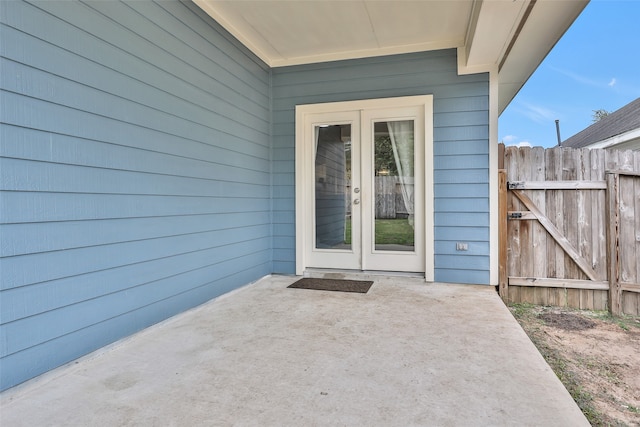 entrance to property with a patio