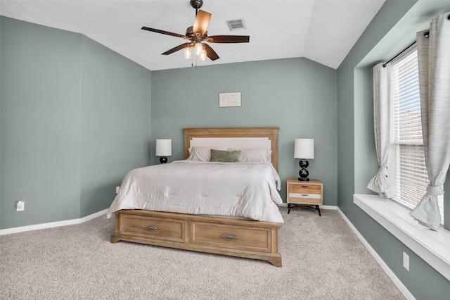 carpeted bedroom with ceiling fan and lofted ceiling