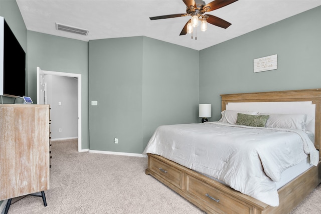 bedroom with light carpet and ceiling fan