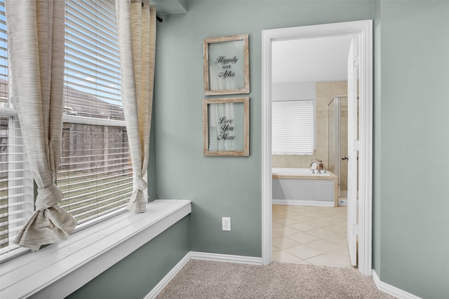 hallway featuring light tile patterned flooring