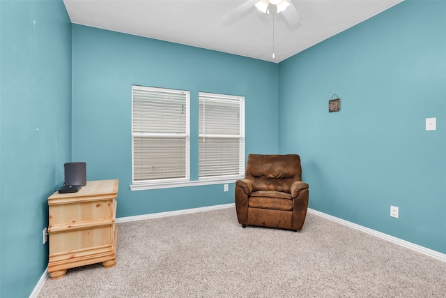 sitting room featuring ceiling fan and carpet floors