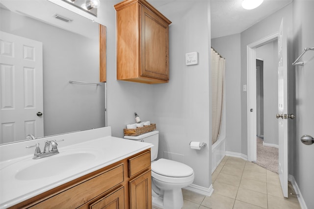 full bathroom featuring vanity, shower / tub combo with curtain, toilet, and tile patterned flooring