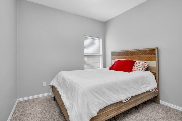 bedroom featuring light carpet