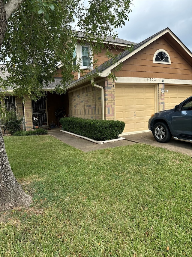 view of home's exterior with a lawn and a garage