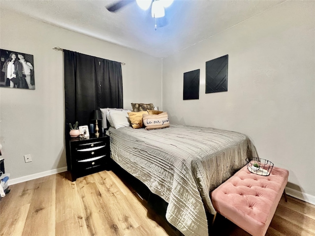 bedroom featuring wood-type flooring and ceiling fan