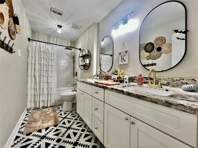 full bathroom featuring vanity, toilet, and shower / bath combo