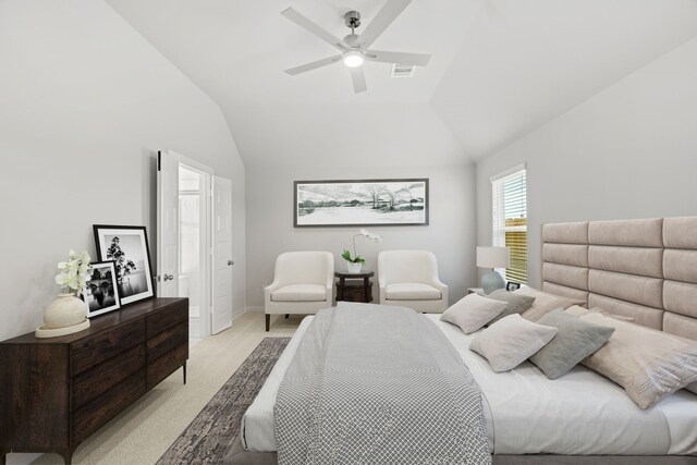 bedroom with lofted ceiling, light colored carpet, and ceiling fan