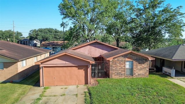 view of front of property featuring a front yard and a garage