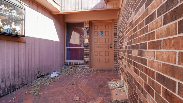 property entrance featuring a patio area