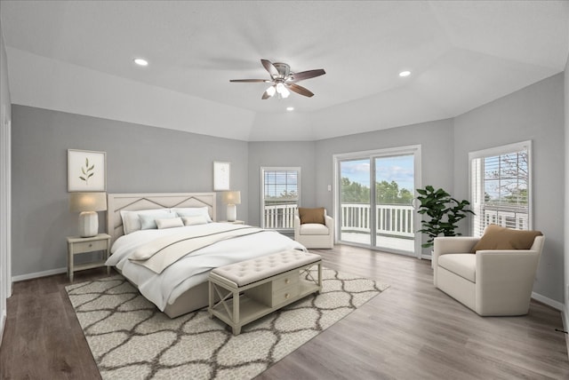 bedroom featuring hardwood / wood-style floors, access to exterior, and ceiling fan