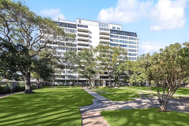 view of property's community with a lawn