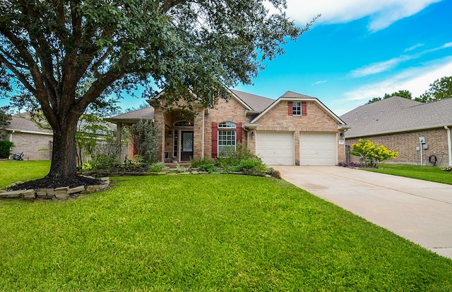 view of front of house with a front yard and a garage