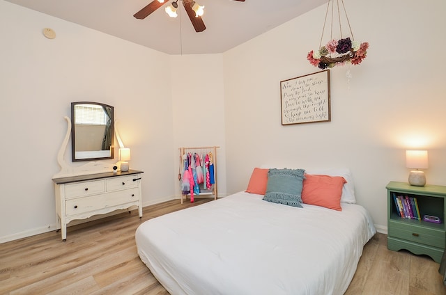 bedroom featuring light hardwood / wood-style floors and ceiling fan