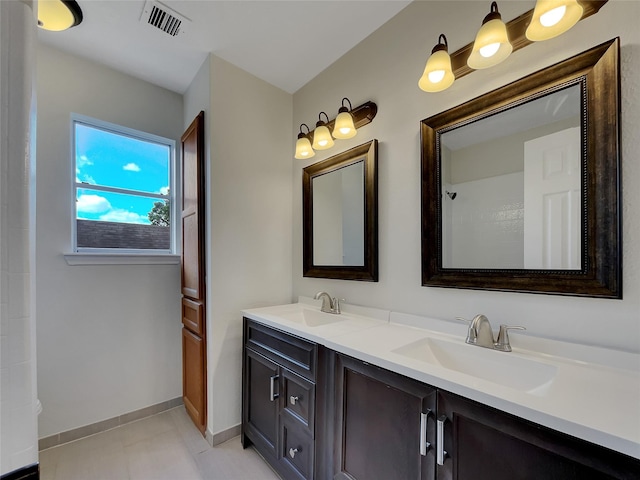 14718 W Bend Dr, Houston, TX 77082 - bathroom featuring double vanity and baseboards