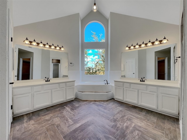 14718 W Bend Dr, Houston, TX 77082 - full bath featuring high vaulted ceiling, a bath, two vanities, a stall shower, and a closet