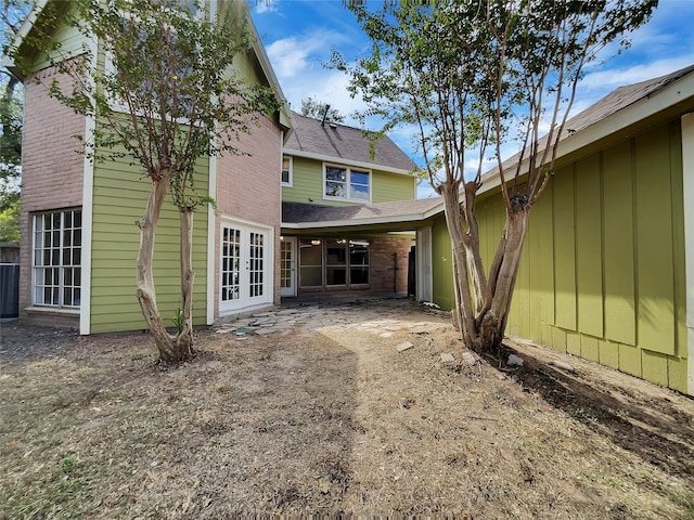 back of property featuring french doors