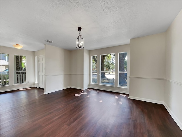 14718 W Bend Dr, Houston, TX 77082 - spare room with plenty of natural light, baseboards, wood finished floors, and a textured ceiling