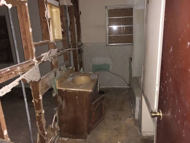 bathroom with vanity and concrete floors