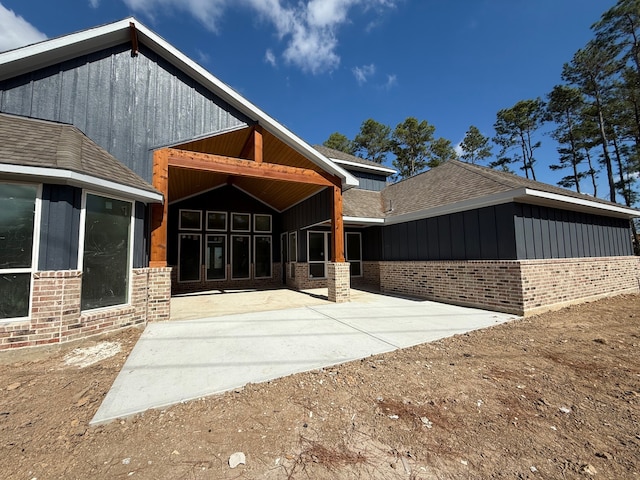 back of property with a patio area