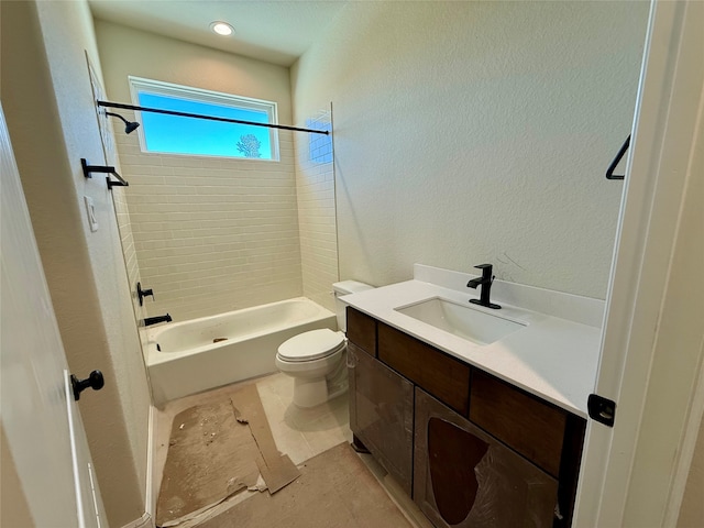 full bathroom with tile patterned floors, vanity, toilet, and tiled shower / bath combo