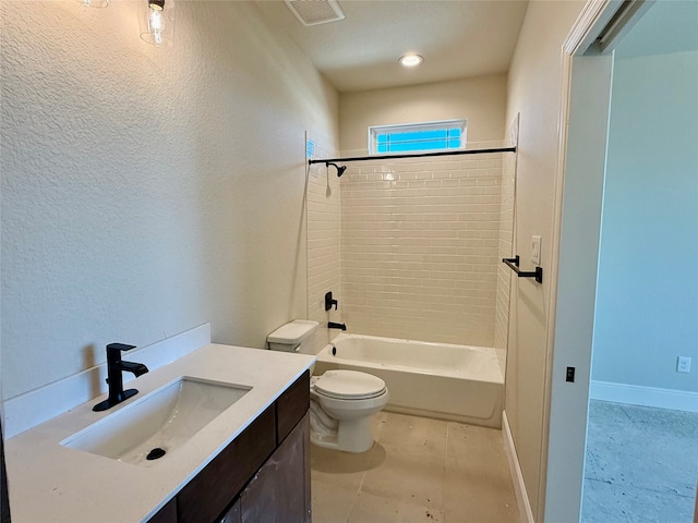 full bathroom with tile patterned floors, tiled shower / bath combo, toilet, and vanity