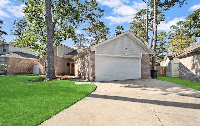 view of front of property featuring a garage and a front yard