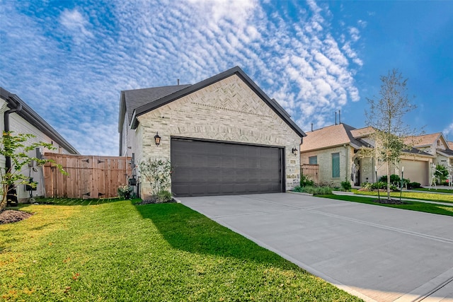 view of front of home featuring a front lawn and a garage